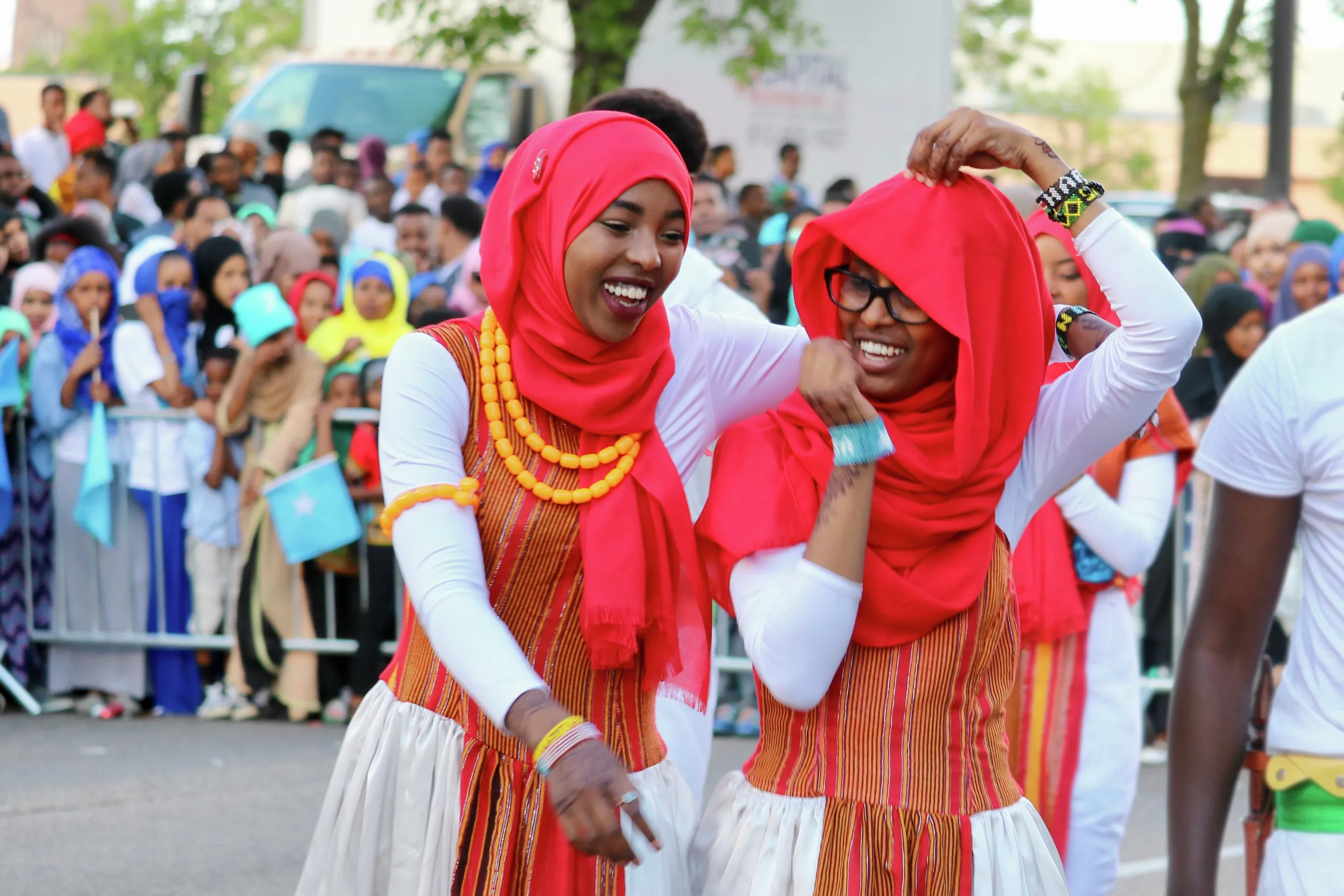 Two Somali dancers laughing