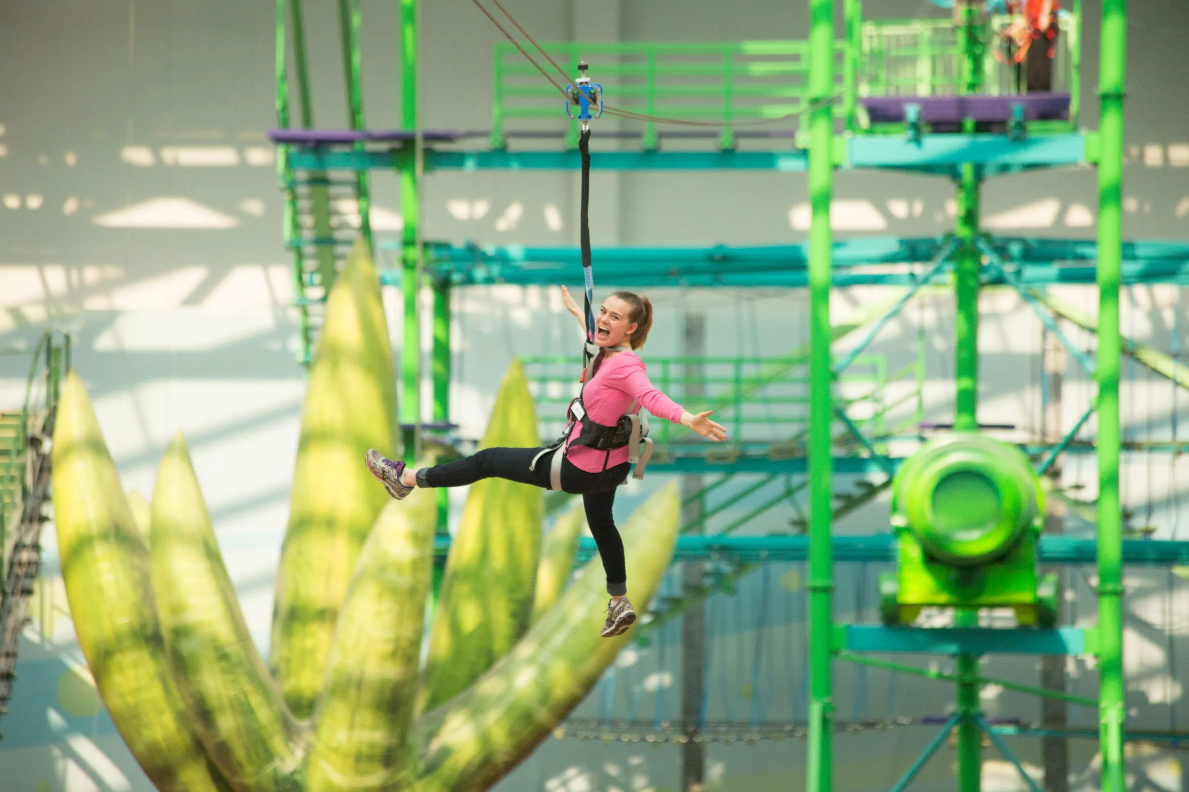 Woman on an indoor zip line at Mall of America