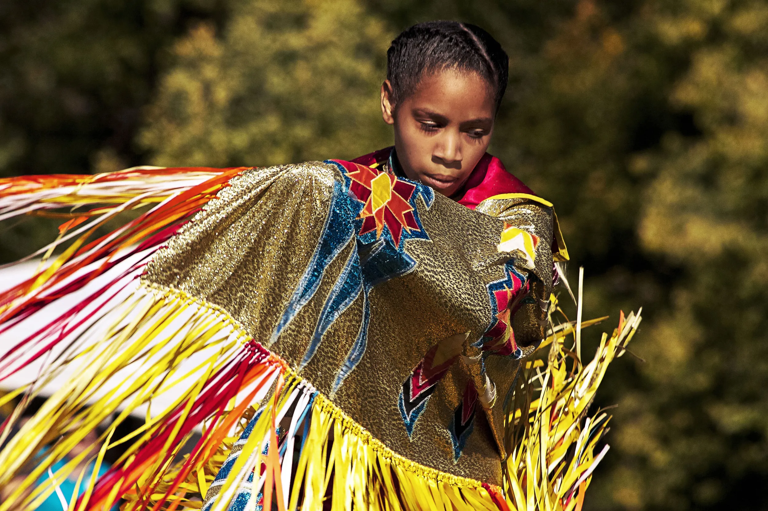 Young dancer in pow wow regalia