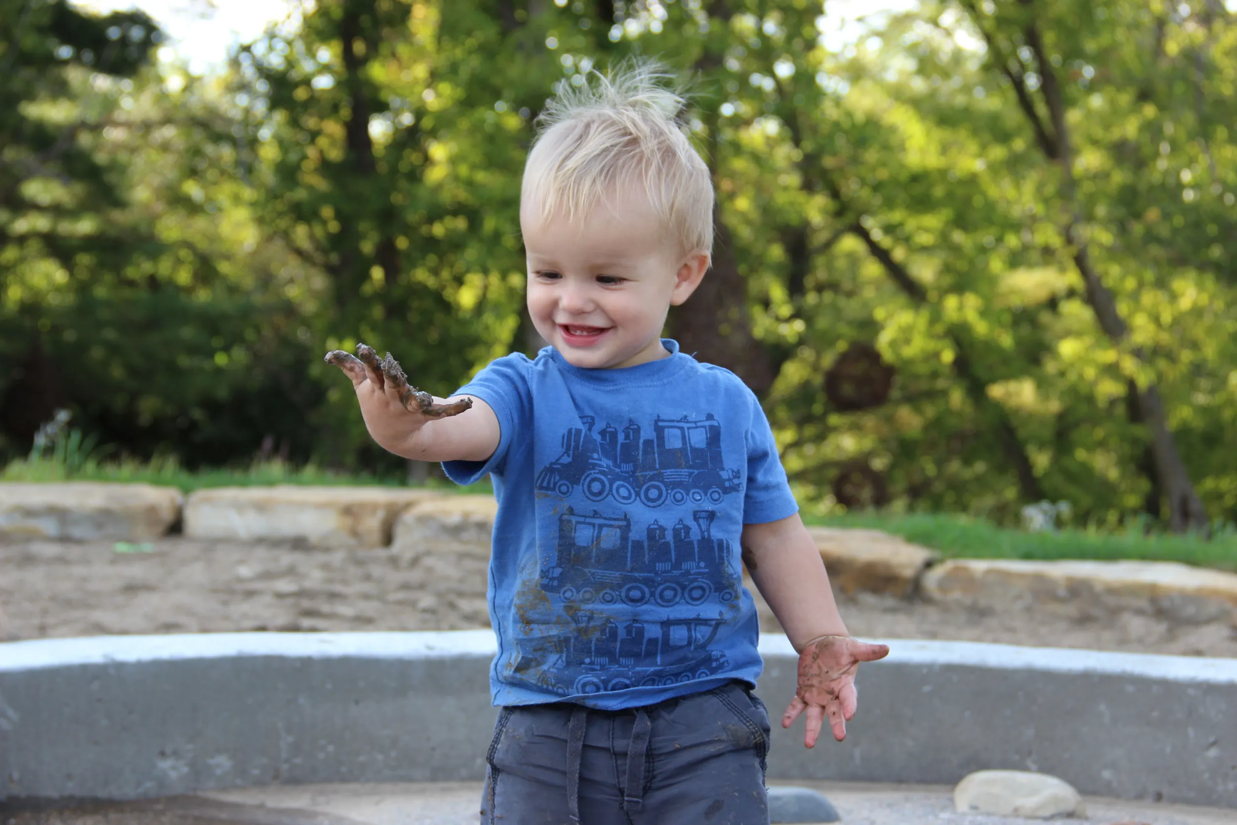 Boy playing in mud