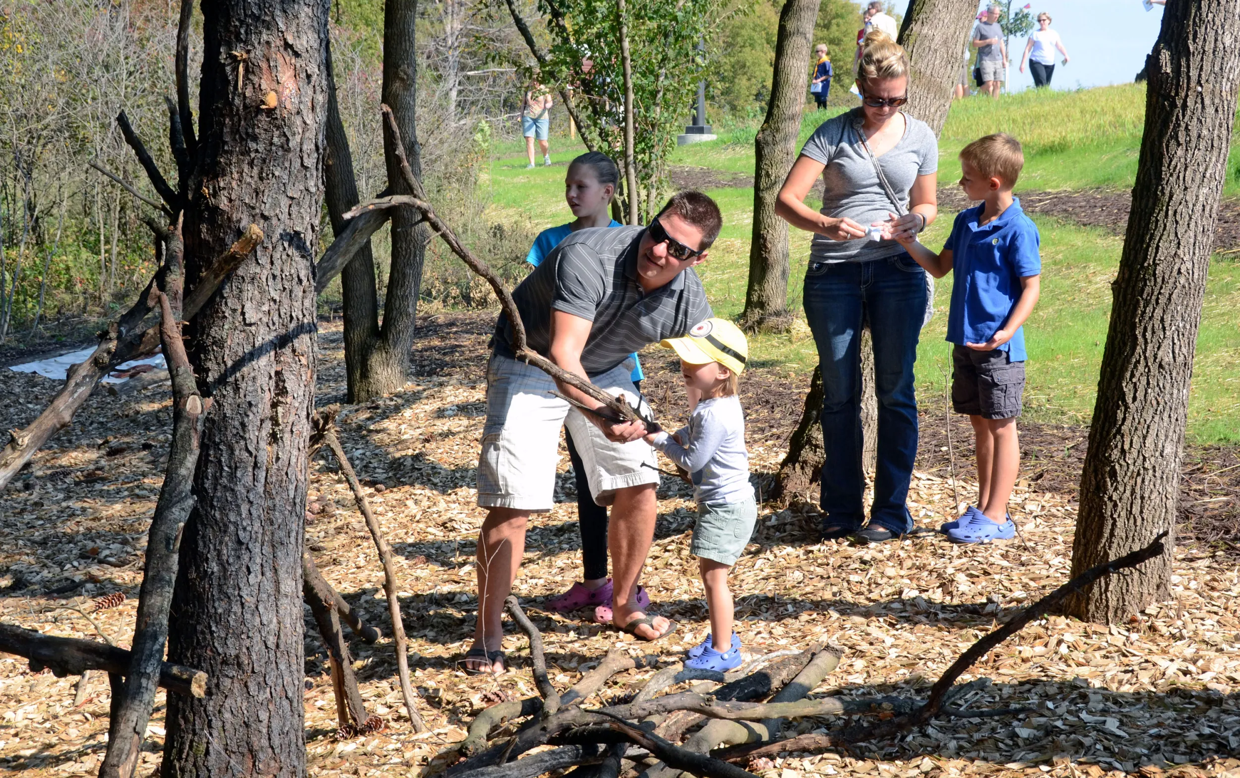 Father and son in Whitetail Woods natural play area