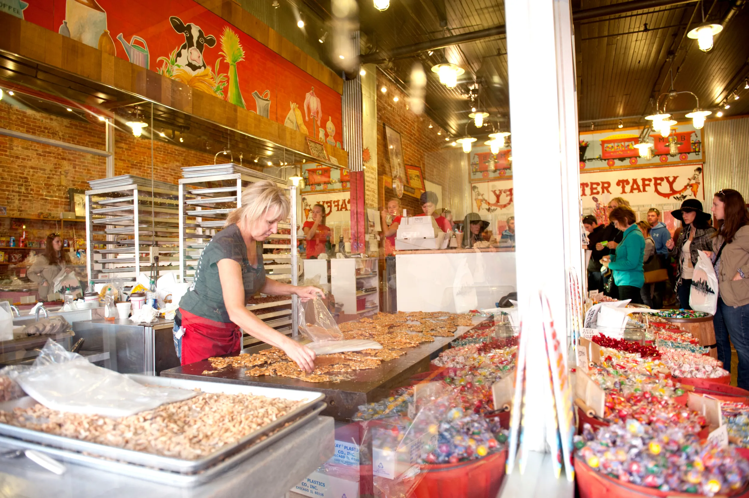 Woman making peanut brittle at Tremblay's