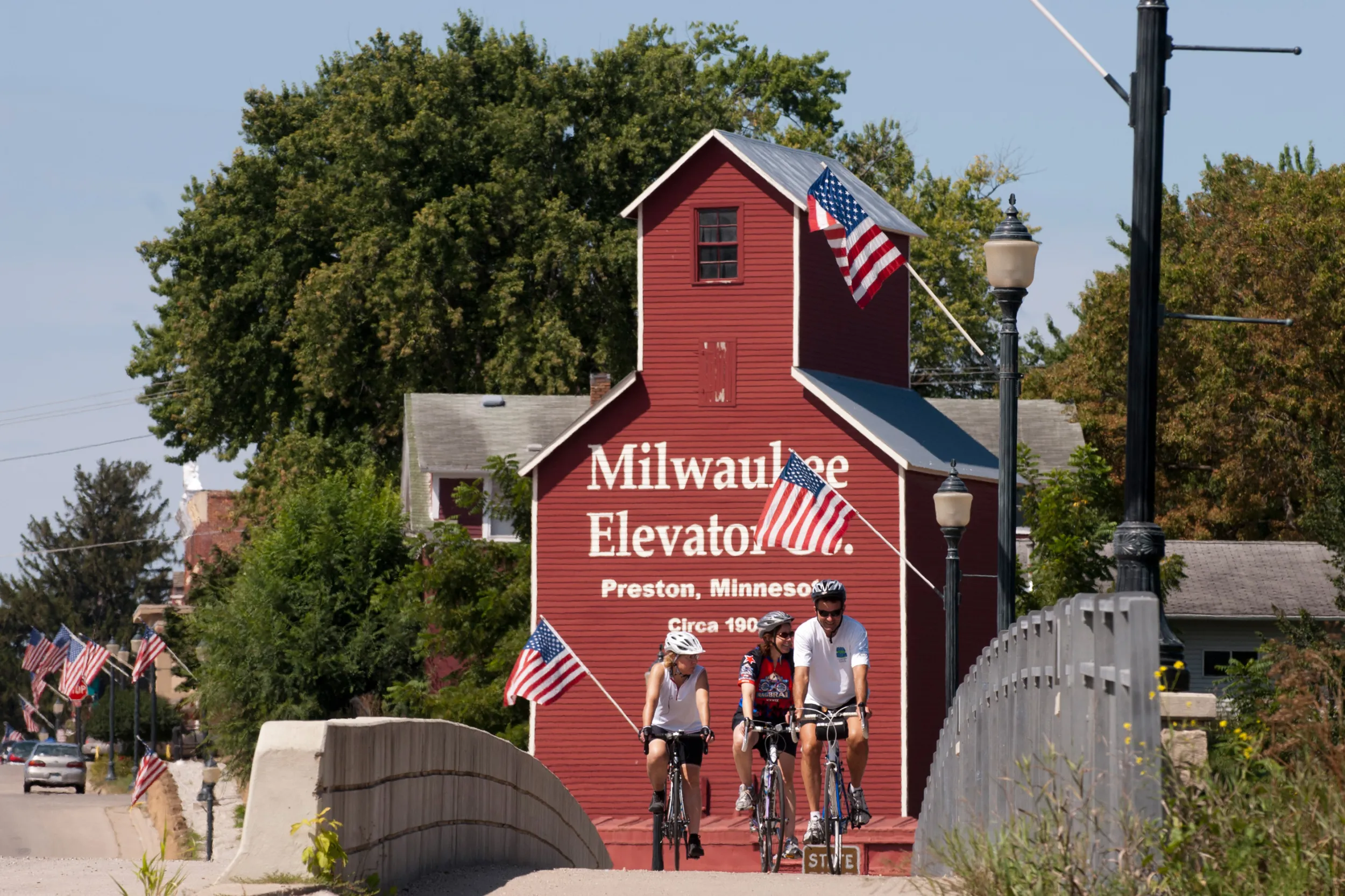 Bikers cross bridge on Root River Trail