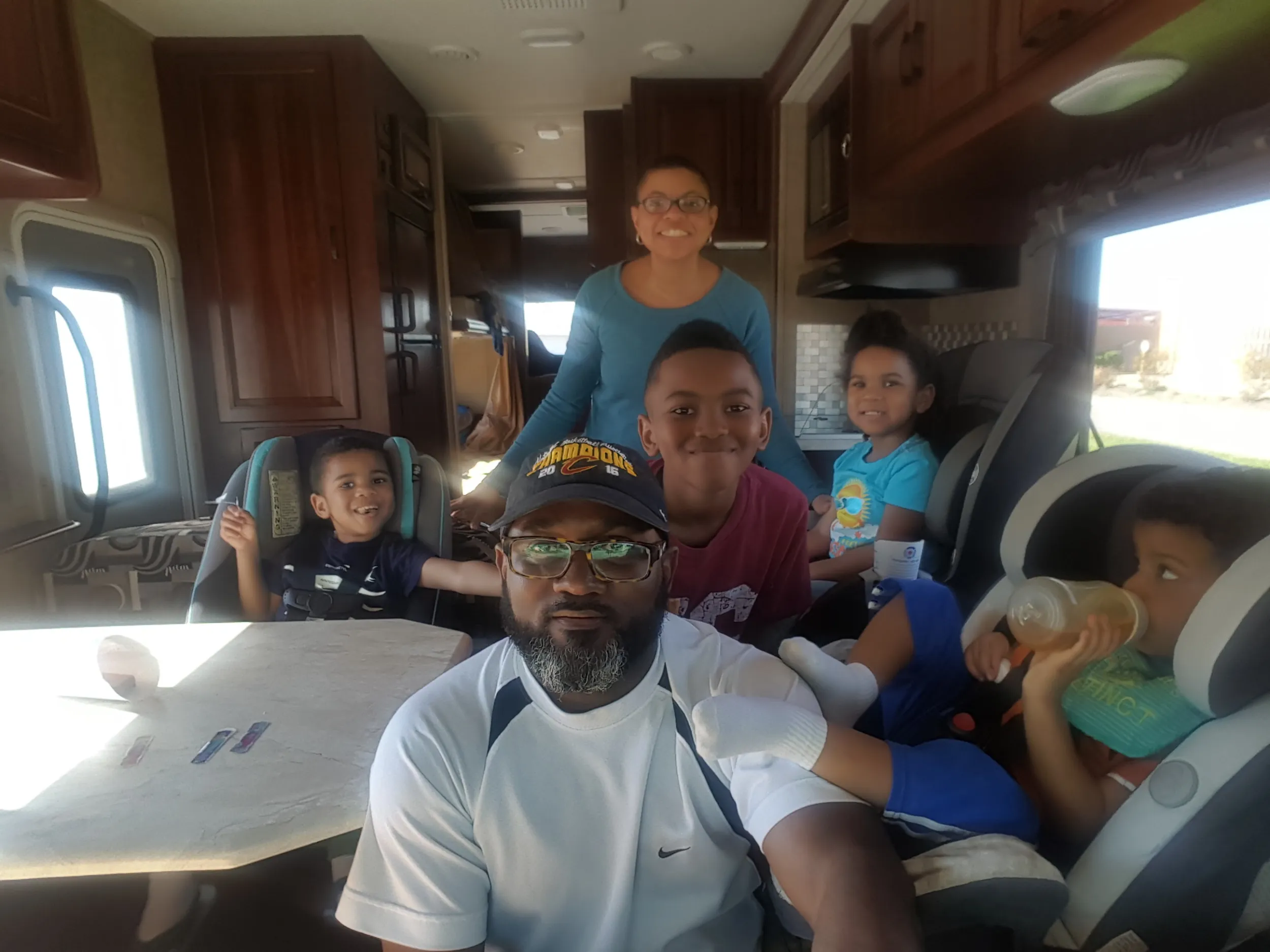 The Brundidge family poses for a photo inside their RV