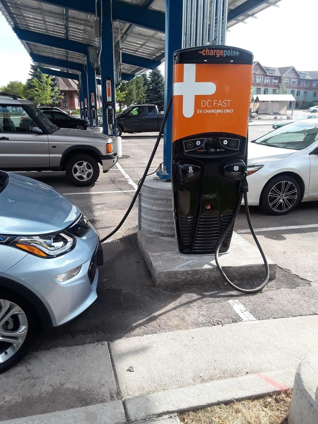 Car charging beneath the solar-powered charging station in Duluth