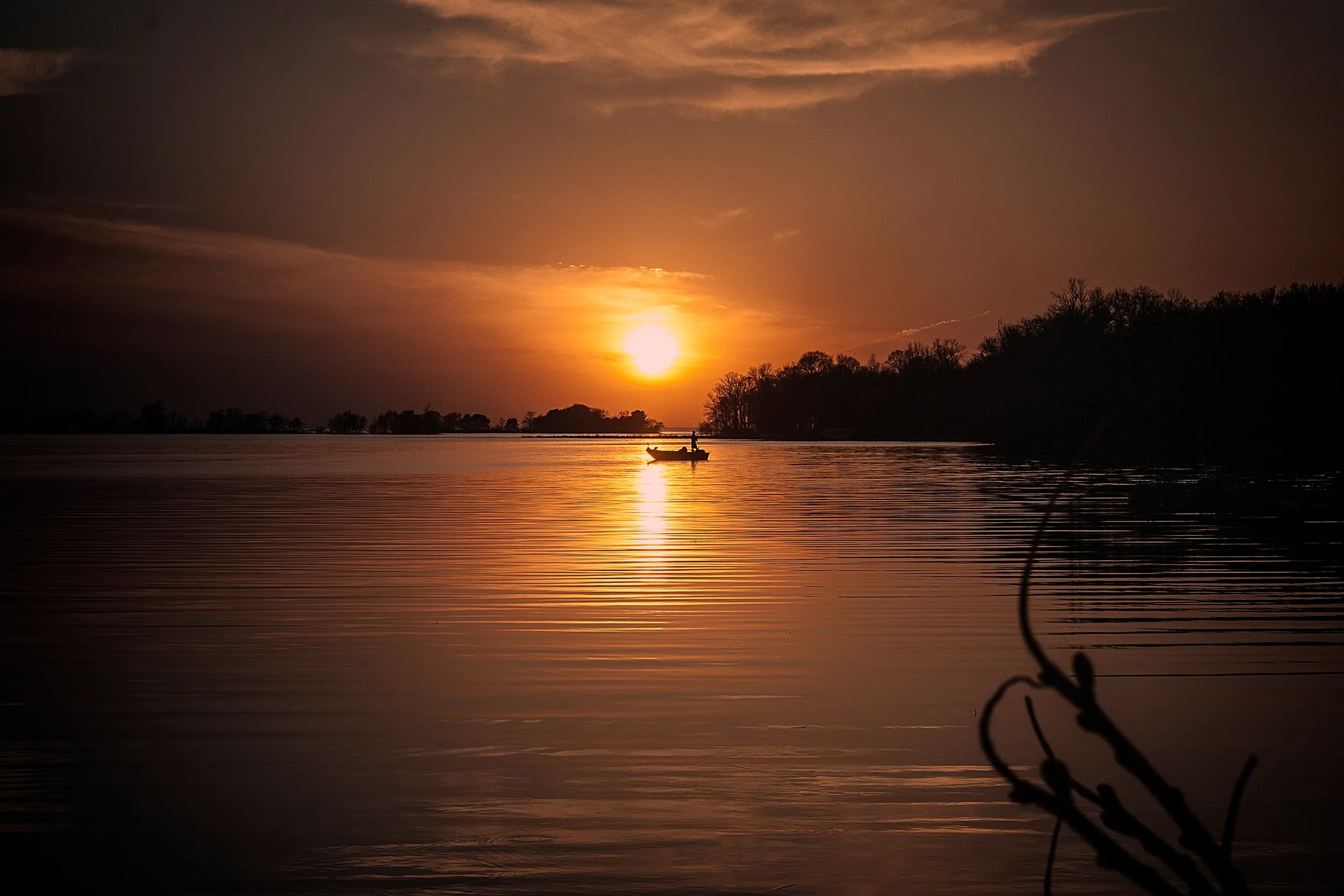 Sunset and a single boat on Lake Mille Lacs