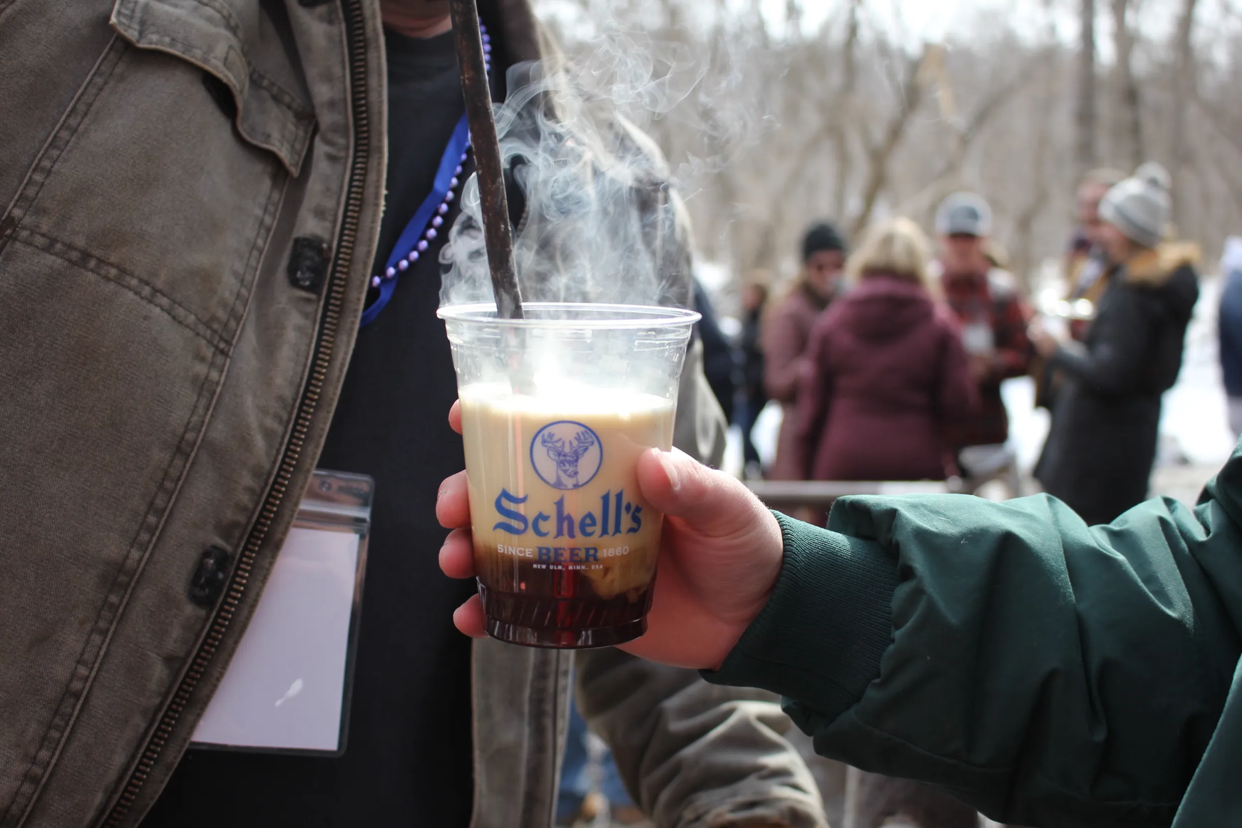 A poker gets plunged into a beer at Schell's BockFest