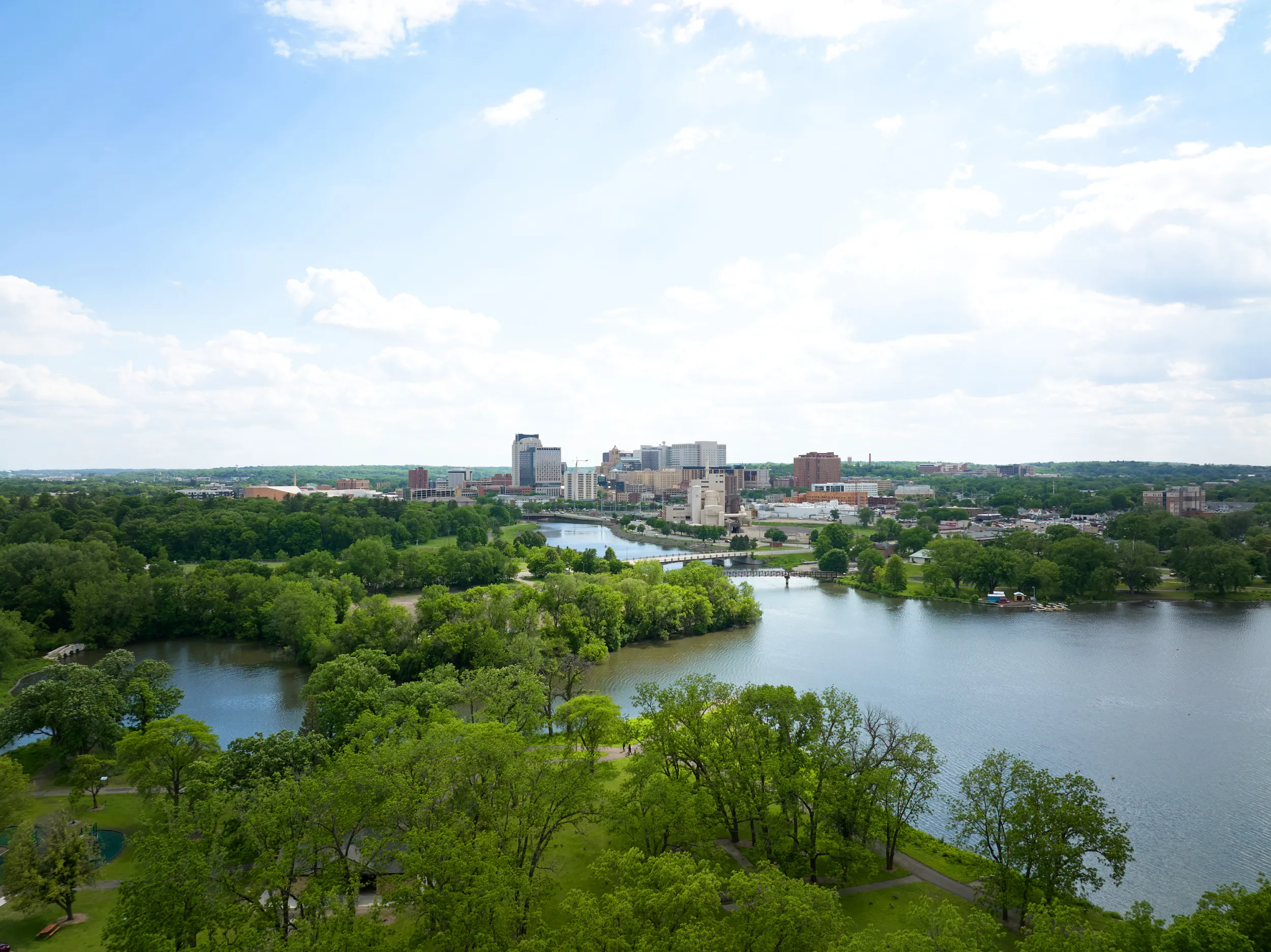 An aerial shot of downtown Rochester and its surrounding green spaces