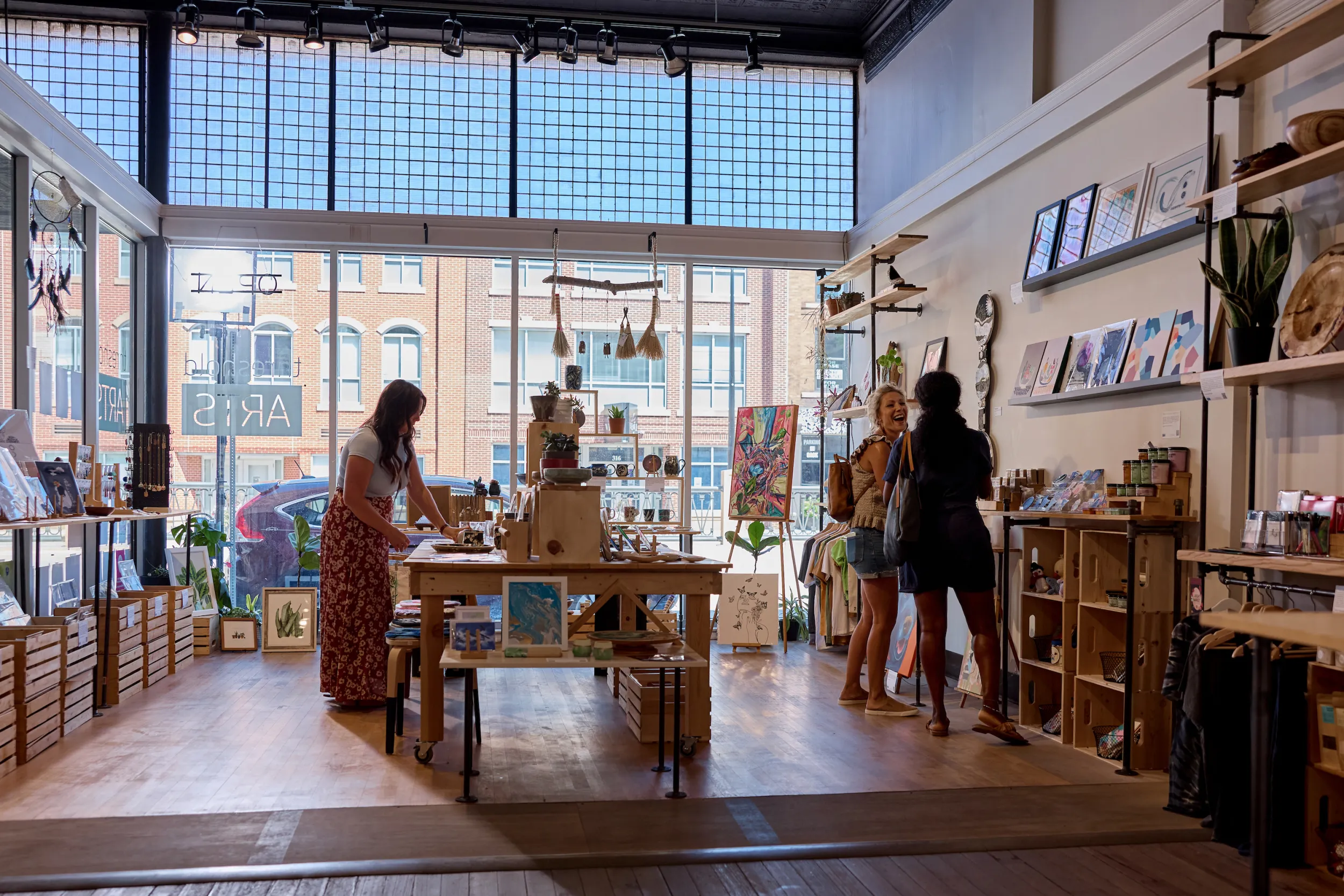 Shoppers at the Makers Market shop in Threshold Arts