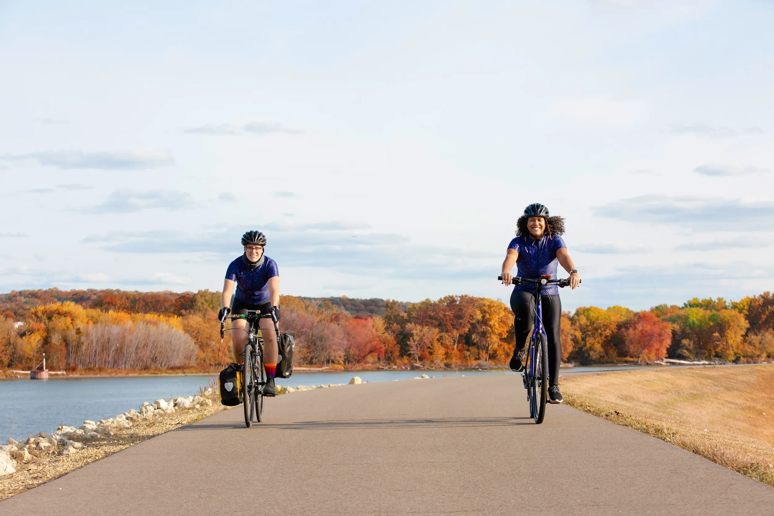 Two women bike along the Mississippi River Trail in South St. Paul
