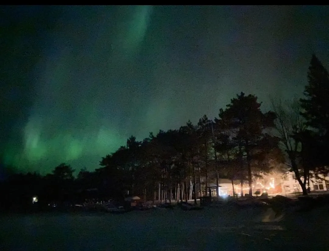 A Northern Lights display at Manhattan Beach Lodge