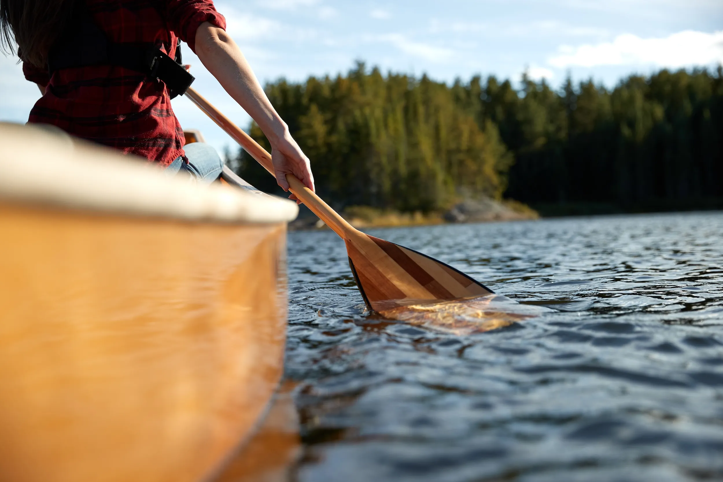 Close up of an oar and side of canoe in the Boundary Waters