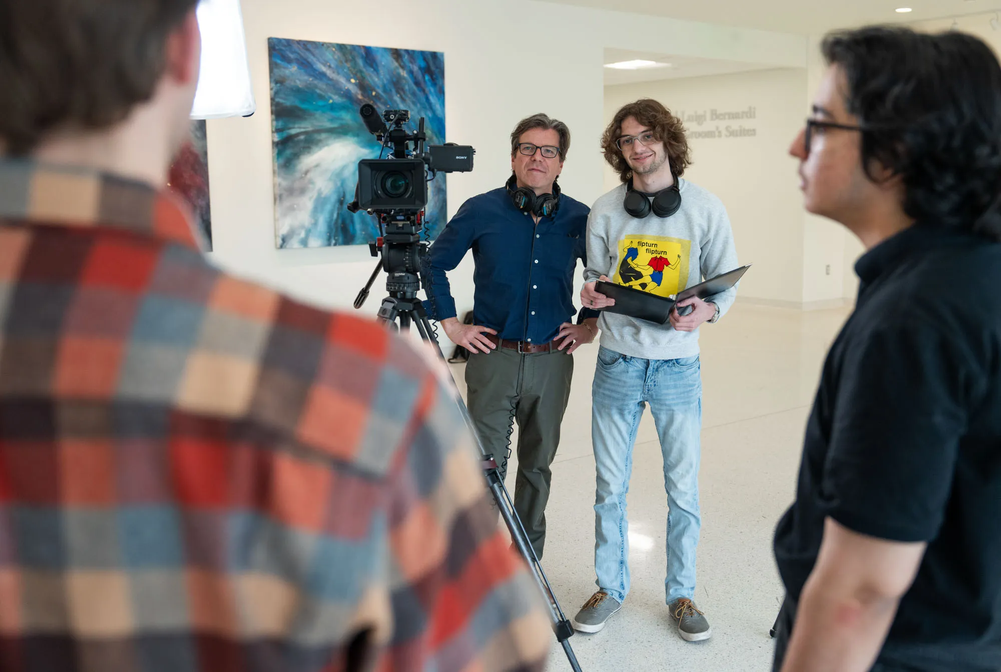Filmmaker Jim Snapko leads a documentary shoot with University of St. Thomas students
