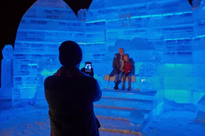 People posing for a picture in the ice palace at Detroit Lakes Polar Fest