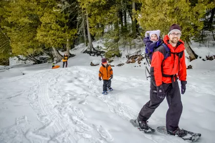 Dad and kids snowshoeing on the North Shore of Lake Superior