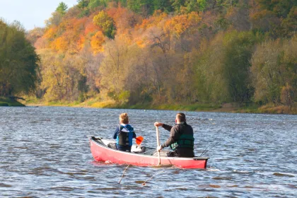 Father and son canoeing in the fall