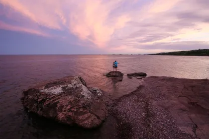 Couple watching the sunset on Lake Superior