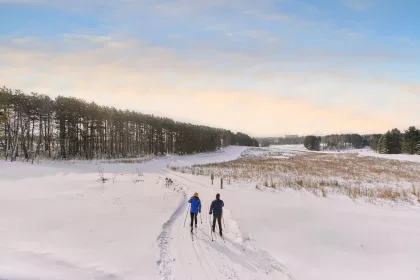 Two cross-country skiers at Whitetail Woods