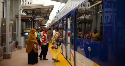 Customers board the Metro Green Line lightrail