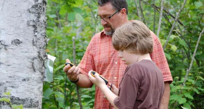 Dad and son geocaching at Tettegouche State Park