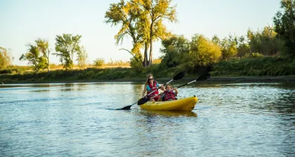 mother and daughter kayaking on the red river