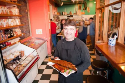 Northern Waters Smokehaus owner with fish