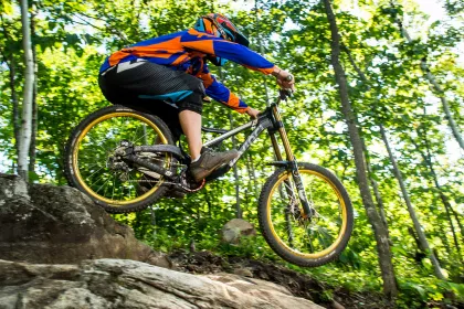 Mountain biker jumping over rocks at Spirit Mountain in Duluth