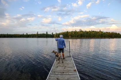 Man fishing on a dock in Superior National Forest