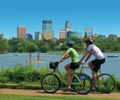 Biking around Bde Maka Ska, Minneapolis skyline in background