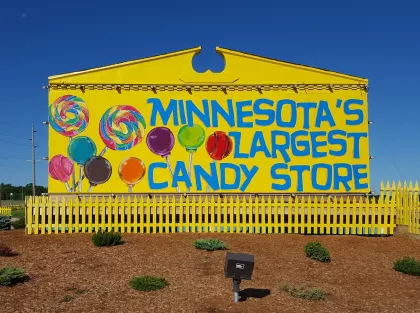 Yellow sign that says Minnesota's Largest Candy Store