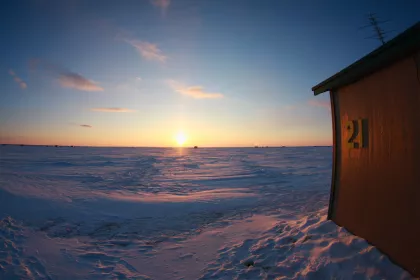 Winter sunset on Lake Mille Lacs ice fishing shack