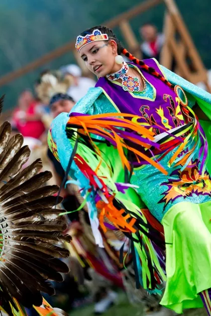 Woman dances at Grand Portage annual powwow