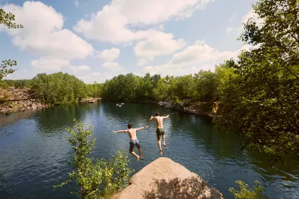 Cliff jumping off rocks at Quarry Park