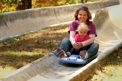 Mother and daughter on Alpine Slide at Wild Mountain