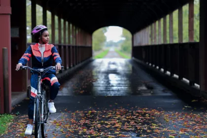 Woman biking on the Lake Wobegon Trail