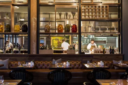 The interior and kitchen of Tullibee at the Hewing Hotel