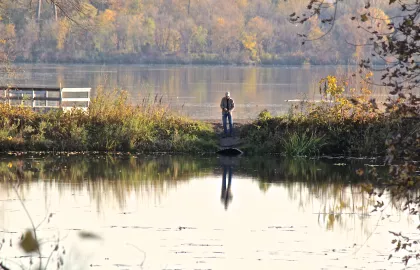 A man fishing in Fort Snelling State Park
