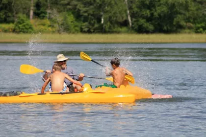 Family kayaking on Lake Itasca