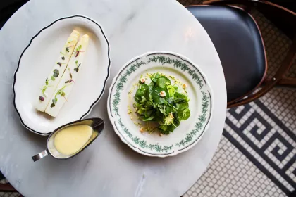 Salad and a side with dressing at Meritage in St. Paul
