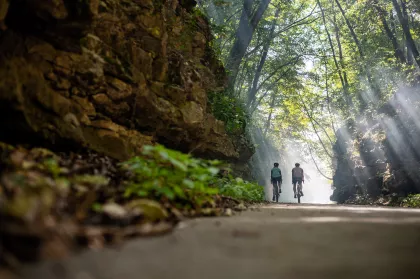 A pair of bikers on Root River bike trail, Lanesboro