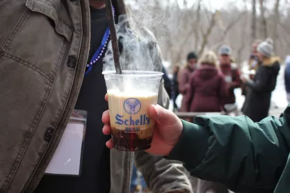A poker gets plunged into a beer at Schell's BockFest