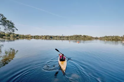Person kayaking the Chain of Lakes in Minneapolis