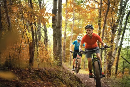 A couple goes mountain biking in Cuyuna during the fall