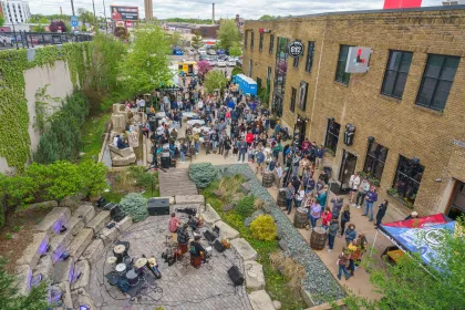 A crowd gathers to view art and listen to live music at the popular summer festival, Art-a-Whirl in Minneapolis