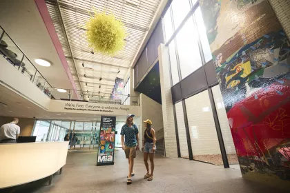 A couple walks into the foyer at the Minneapolis Institute of Art