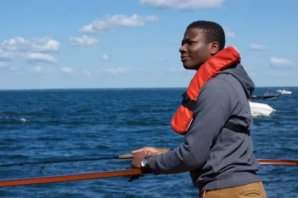 A young man fishes on Lake Mille Lacs