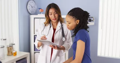 A female doctor discusses treatment options with her patient