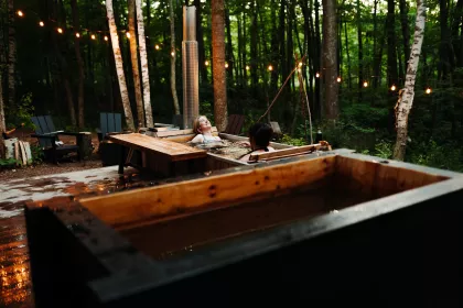 Two women enjoy the hot tub at Silvae Spiritus