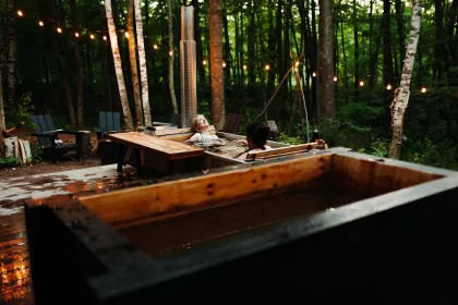 Two women enjoy the hot tub at Silvae Spiritus
