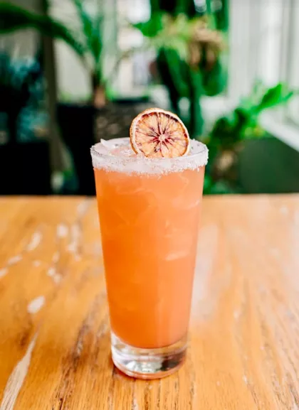 A blood orange margarita on the patio of Nico's Taco Bar